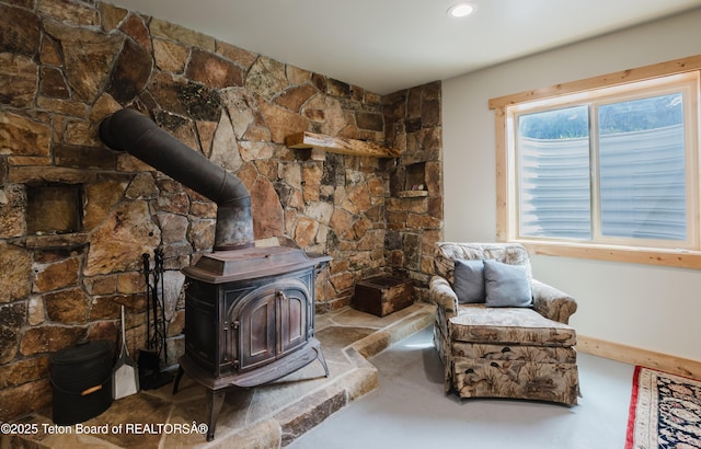 222 River Bench Rd, Alpine, WY 83128 - sitting room featuring a wood stove, finished concrete flooring, and recessed lighting