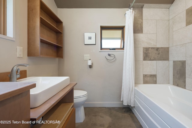 bathroom featuring vanity, toilet, baseboards, shower / bath combo, and concrete floors