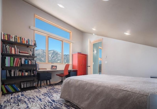 bedroom with recessed lighting and a mountain view