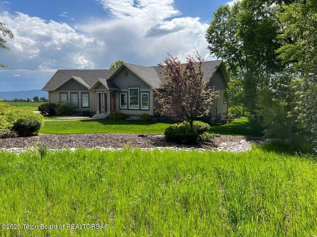 96 Hardman Rd, Star Valley Ranch, WY 83127 - craftsman-style home featuring a front lawn and board and batten siding
