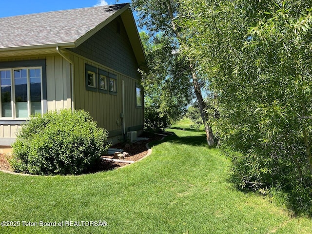 96 Hardman Rd, Star Valley Ranch, WY 83127 - view of property exterior featuring a shingled roof and a yard