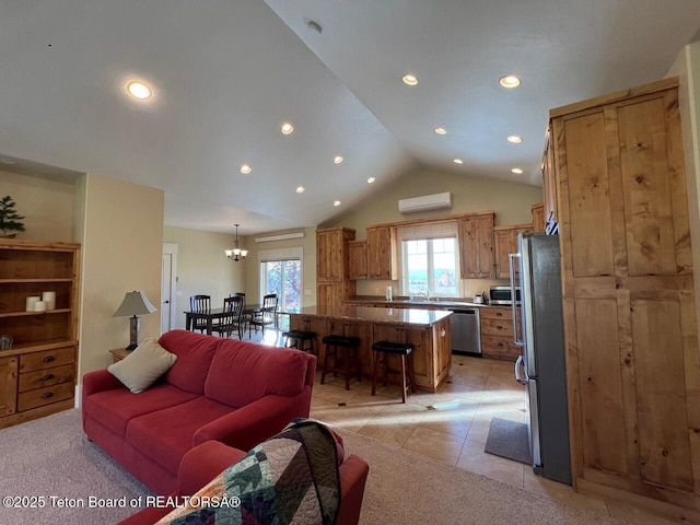 96 Hardman Rd, Star Valley Ranch, WY 83127 - living room with an AC wall unit, plenty of natural light, recessed lighting, a chandelier, and lofted ceiling