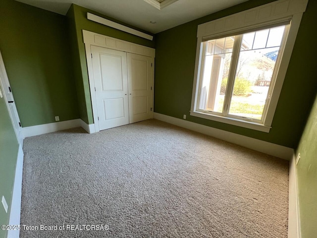 96 Hardman Rd, Star Valley Ranch, WY 83127 - unfurnished bedroom featuring carpet, a closet, and baseboards