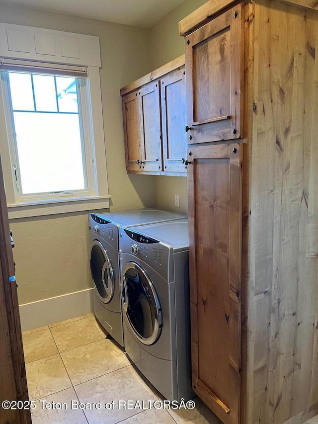 96 Hardman Rd, Star Valley Ranch, WY 83127 - washroom with separate washer and dryer, cabinet space, tile patterned flooring, and baseboards