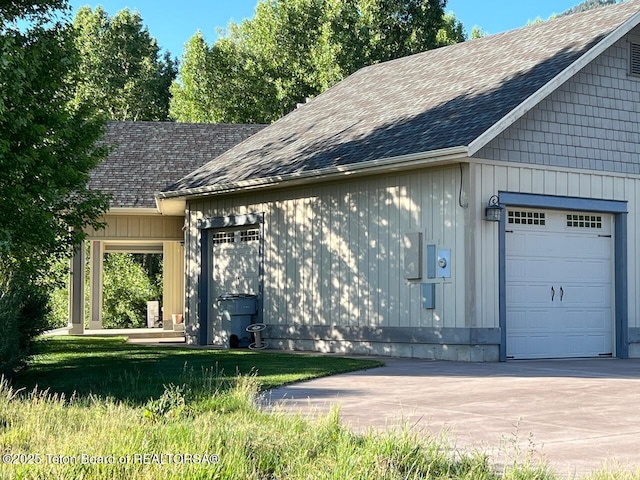 96 Hardman Rd, Star Valley Ranch, WY 83127 - view of property exterior with a shingled roof, a garage, and concrete driveway