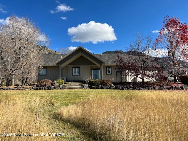 96 Hardman Rd, Star Valley Ranch, WY 83127 - ranch-style house featuring roof with shingles and covered porch