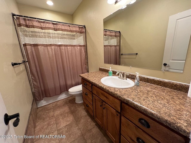 96 Hardman Rd, Star Valley Ranch, WY 83127 - full bath featuring vanity, toilet, and tile patterned floors