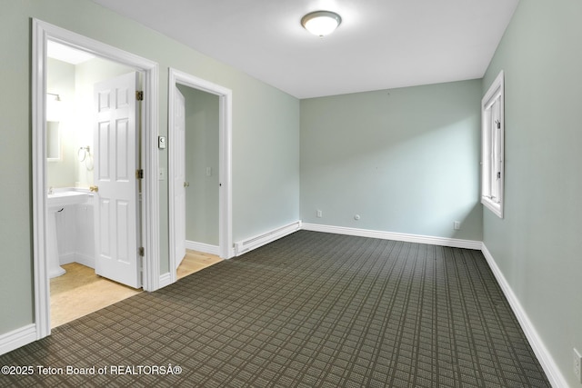 3455 S Tensleep Dr Unit 16, Jackson, WY 83001 - carpeted spare room featuring baseboard heating and baseboards