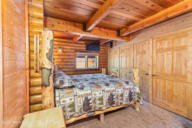 185 River Bench Rd, Thayne, WY 83127 - carpeted bedroom with rustic walls, wooden ceiling, and beam ceiling