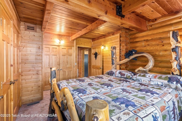 185 River Bench Rd, Thayne, WY 83127 - bedroom with wooden ceiling, beam ceiling, and carpet floors