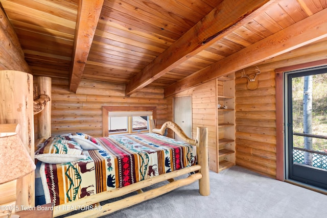 185 River Bench Rd, Thayne, WY 83127 - carpeted bedroom featuring rustic walls, beam ceiling, and wood ceiling