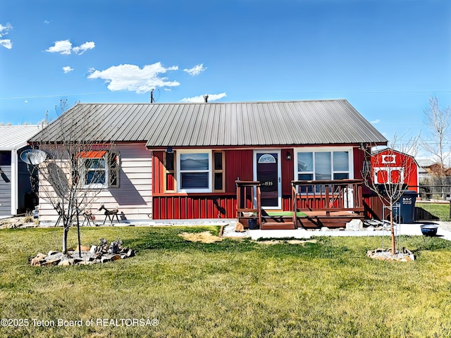 1535 Miller Way, Big Piney, WY 83113 - view of front of home with a front yard, metal roof, and a porch