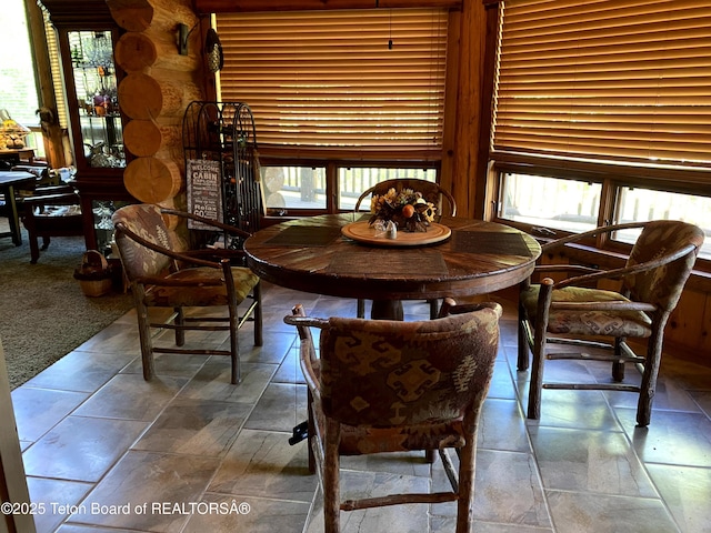 3 Forest Trl, Boulder, WY 82923 - dining space with stone tile floors and rustic walls