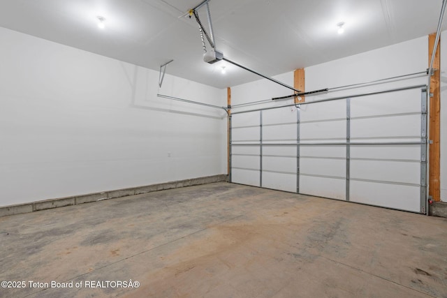 68 Alpine Trl Unit 38, Victor, ID 83455 - garage featuring a garage door opener
