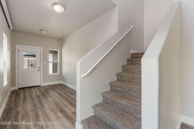 68 Alpine Trl Unit 38, Victor, ID 83455 - entryway featuring wood finished floors, stairway, and baseboards