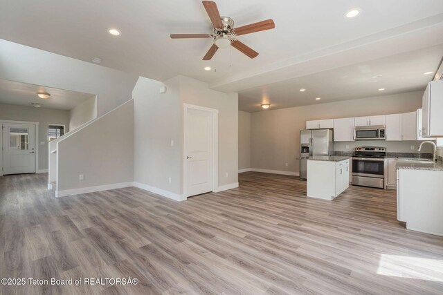 68 Alpine Trl Unit 38, Victor, ID 83455 - unfurnished living room featuring a sink, recessed lighting, baseboards, light wood-style floors, and ceiling fan