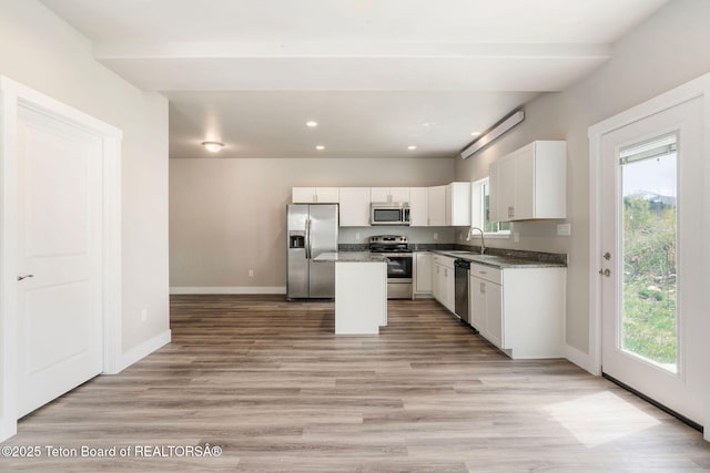 68 Alpine Trl Unit 38, Victor, ID 83455 - kitchen featuring stainless steel appliances, healthy amount of natural light, baseboards, a sink, and recessed lighting