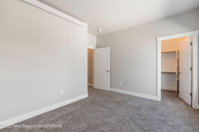 68 Alpine Trl Unit 38, Victor, ID 83455 - unfurnished bedroom with carpet flooring, a spacious closet, and baseboards