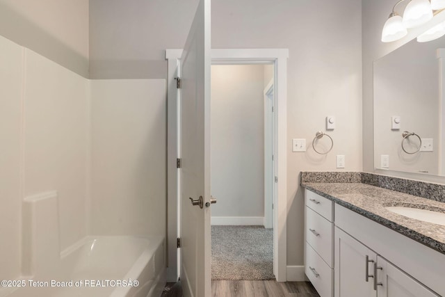 68 Alpine Trl Unit 38, Victor, ID 83455 - bathroom with wood finished floors, vanity, and baseboards