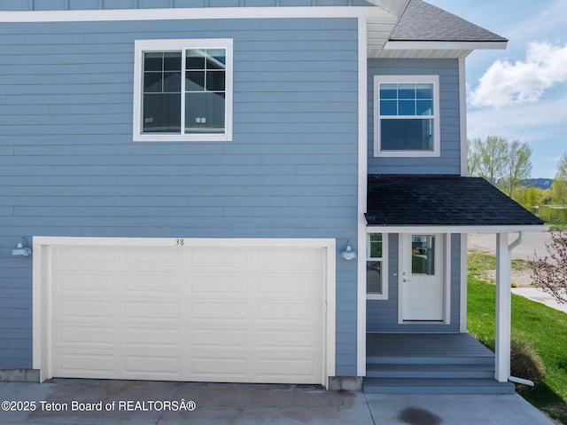 68 Alpine Trl Unit 38, Victor, ID 83455 - view of front of property with a shingled roof and an attached garage