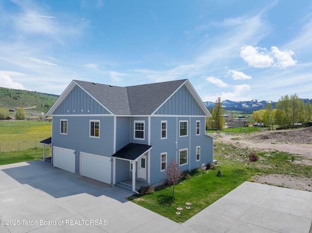68 Alpine Trl Unit 38, Victor, ID 83455 - view of side of property featuring board and batten siding, roof with shingles, a garage, and a mountain view