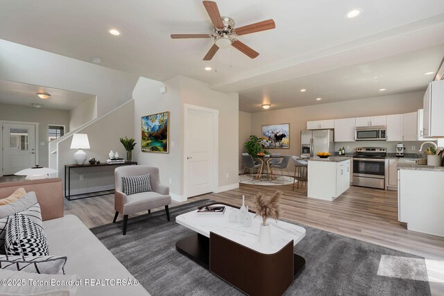68 Alpine Trl Unit 38, Victor, ID 83455 - living area with light wood-style flooring, recessed lighting, baseboards, and ceiling fan