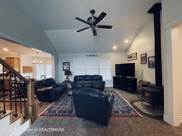 61 Astorian Ln, Smoot, WY 83126 - living room featuring lofted ceiling, stairs, a wood stove, plenty of natural light, and ceiling fan
