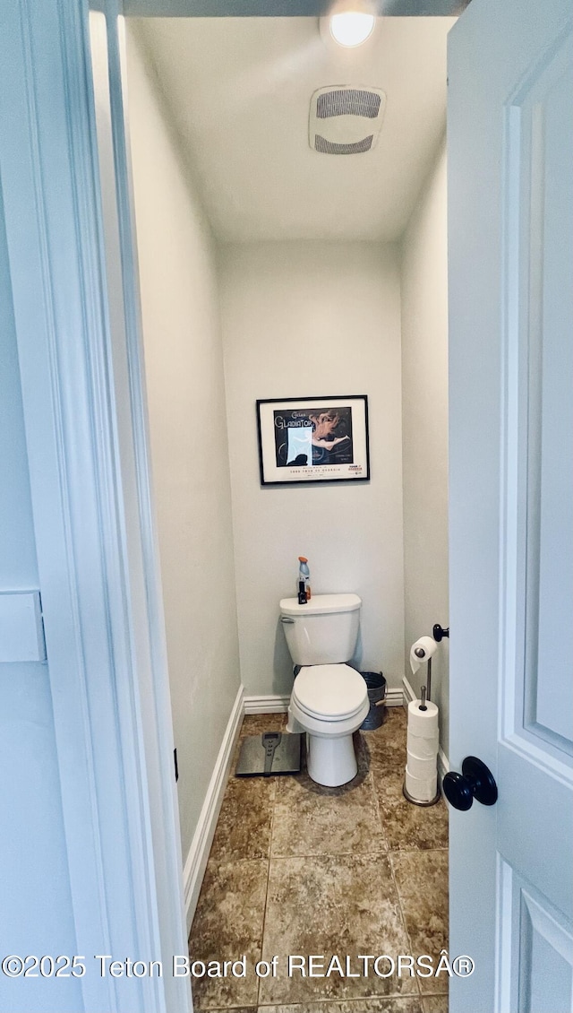 61 Astorian Ln, Smoot, WY 83126 - bathroom featuring baseboards and toilet