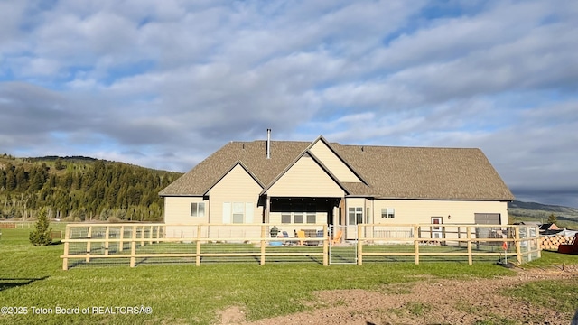 61 Astorian Ln, Smoot, WY 83126 - rear view of property with a lawn and a shingled roof