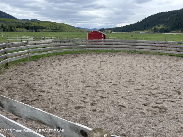 61 Astorian Ln, Smoot, WY 83126 - view of yard featuring a view of countryside, a mountain view, an enclosed riding area, an outbuilding, and an exterior structure