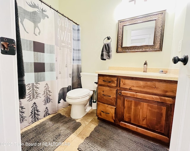 61 Astorian Ln, Smoot, WY 83126 - bathroom featuring toilet, vanity, tile patterned flooring, and curtained shower