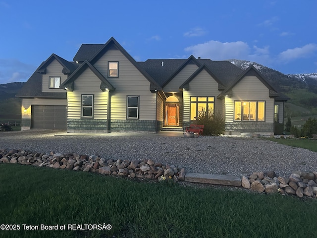 61 Astorian Ln, Smoot, WY 83126 - view of front of house with a garage and a front yard