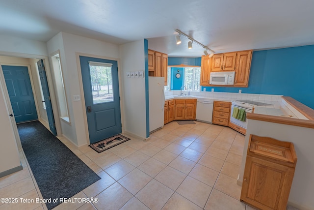 4515 Weslin Trl, Island Park, ID 83429 - kitchen featuring white appliances, a sink, track lighting, and healthy amount of natural light