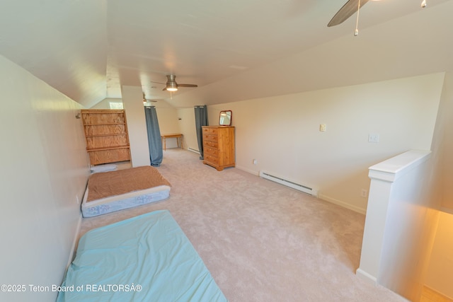 4515 Weslin Trl, Island Park, ID 83429 - unfurnished bedroom featuring a baseboard heating unit, lofted ceiling, carpet floors, baseboards, and ceiling fan