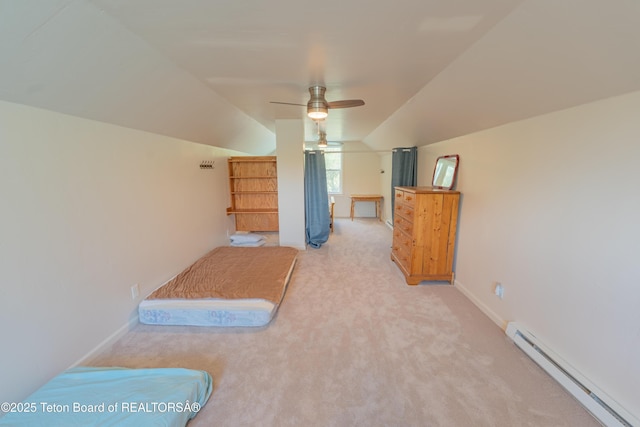 4515 Weslin Trl, Island Park, ID 83429 - unfurnished bedroom with a baseboard radiator, vaulted ceiling, light colored carpet, baseboards, and ceiling fan