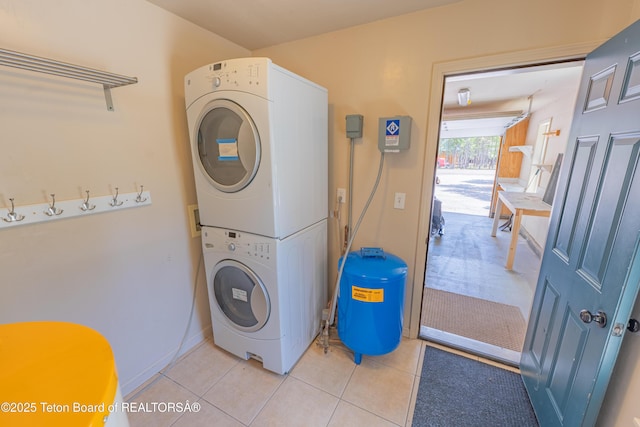 4515 Weslin Trl, Island Park, ID 83429 - clothes washing area with stacked washing machine and dryer and light tile patterned floors