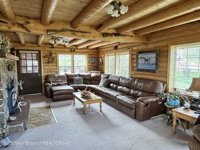 31 Cutoff Rd, Daniel, WY 83115 - carpeted living room with rustic walls and wood ceiling with exposed beams