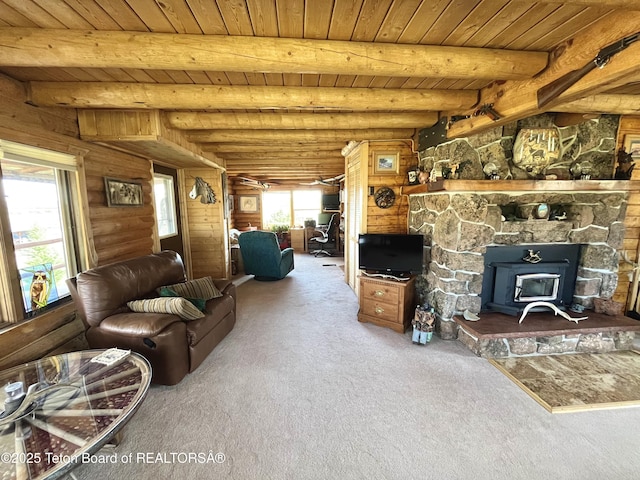 31 Cutoff Rd, Daniel, WY 83115 - carpeted living area with a wood stove and wooden ceiling with exposed beams