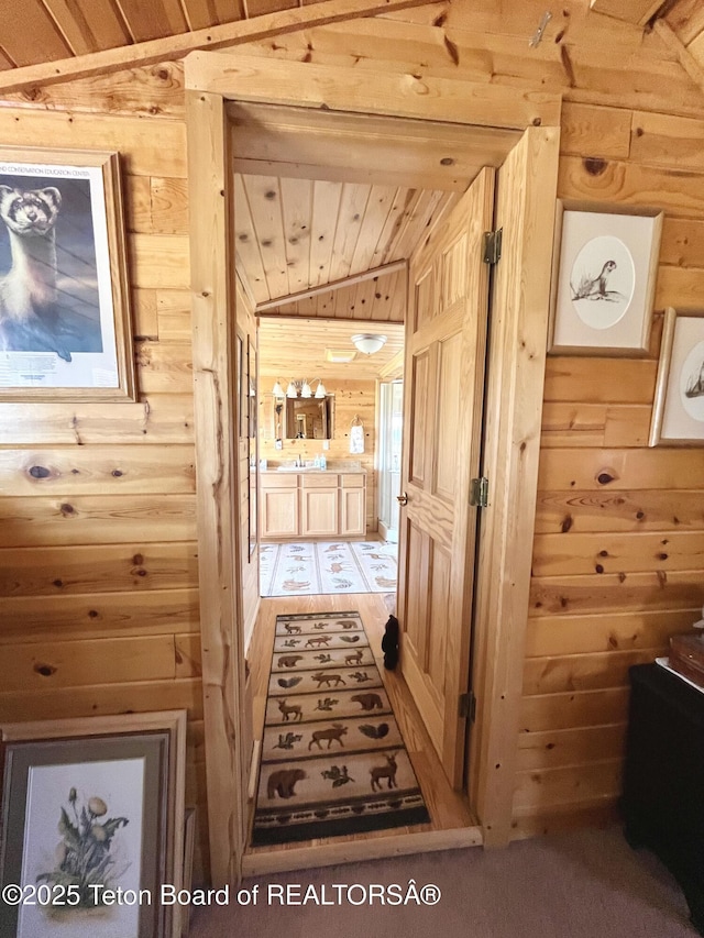 31 Cutoff Rd, Daniel, WY 83115 - hall with vaulted ceiling, wood walls, a sink, and wooden ceiling