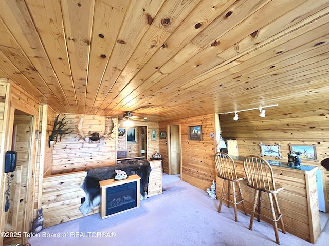 31 Cutoff Rd, Daniel, WY 83115 - living room featuring wooden walls, carpet floors, ceiling fan, and wooden ceiling