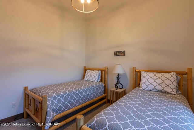8494 Pronghorn Trl, Victor, ID 83455 - carpeted bedroom featuring baseboards