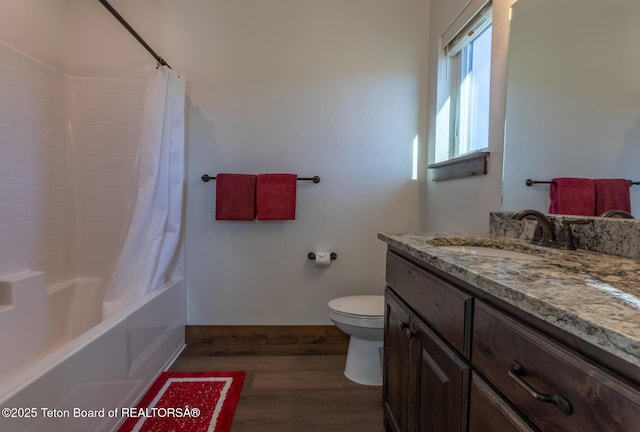 8494 Pronghorn Trl, Victor, ID 83455 - full bath featuring wood finished floors, toilet, vanity, baseboards, and shower / bathtub combination with curtain