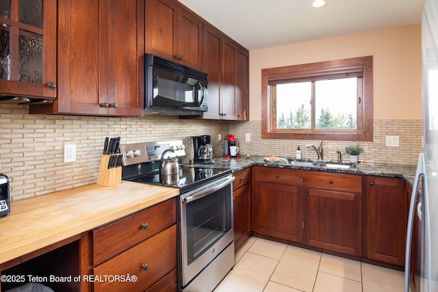 3670 W Michael Dr Unit E-21-E, Teton Village, WY 83025 - kitchen featuring black microwave, stainless steel range with electric cooktop, butcher block counters, a sink, and light tile patterned floors