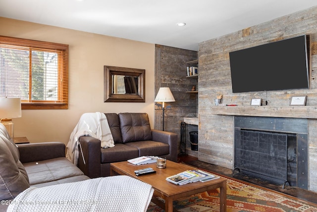 3670 W Michael Dr Unit E-21-E, Teton Village, WY 83025 - living room featuring a stone fireplace, built in shelves, and recessed lighting