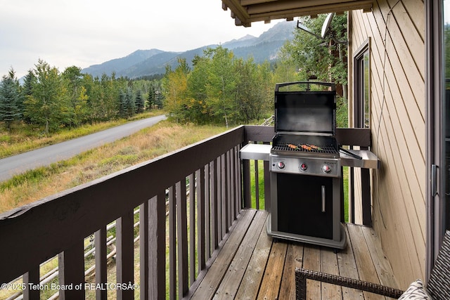 3670 W Michael Dr Unit E-21-E, Teton Village, WY 83025 - deck featuring a view of trees and a mountain view