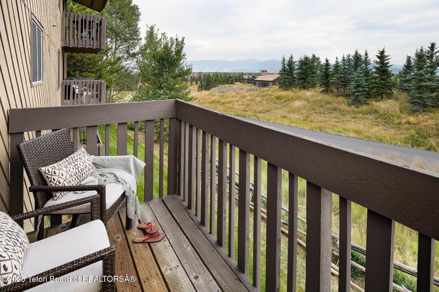 3670 W Michael Dr Unit E-21-E, Teton Village, WY 83025 - wooden terrace featuring a mountain view