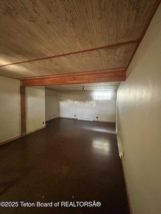 9064 Village Way, Victor, ID 83455 - below grade area featuring wooden ceiling, baseboards, and a baseboard radiator