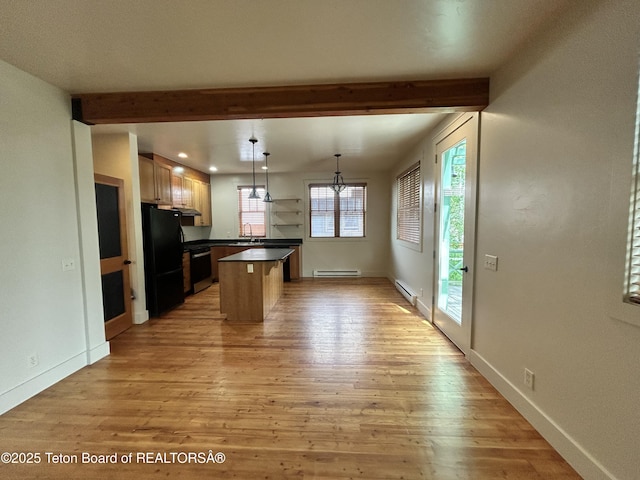 9064 Village Way, Victor, ID 83455 - kitchen featuring freestanding refrigerator, a sink, beamed ceiling, light wood finished floors, and a baseboard radiator