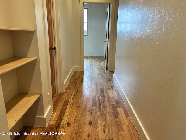 9064 Village Way, Victor, ID 83455 - hallway with hardwood / wood-style floors