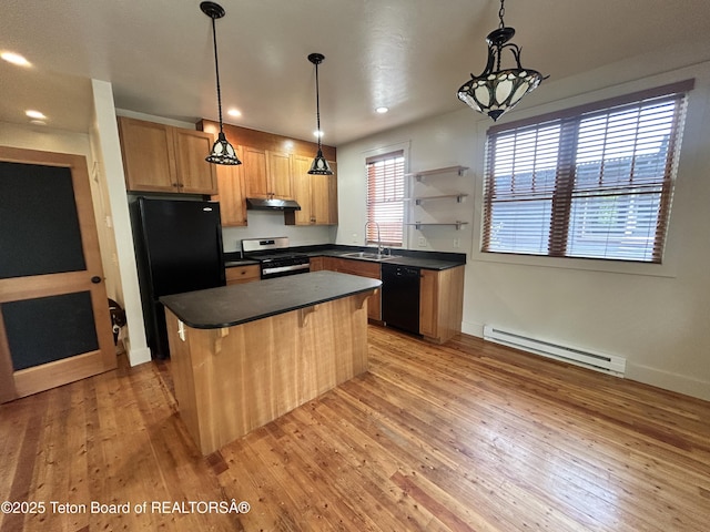 9064 Village Way, Victor, ID 83455 - kitchen featuring black appliances, a baseboard heating unit, under cabinet range hood, dark countertops, and a sink